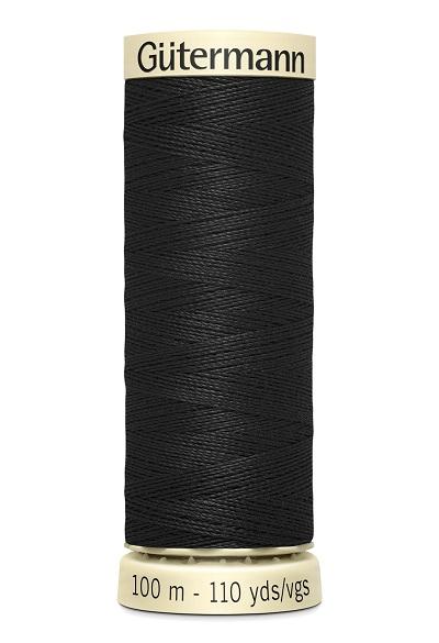 Spool of black thread with 'Gutermann' branding on a white background