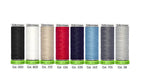 Set of Gutermann thread spools in various colors on a white background