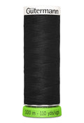Spool of black thread with 'Gütermann' branding on a white background