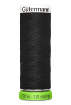 Spool of black thread with 'Gütermann' branding on a white background
