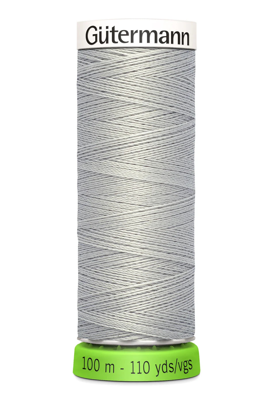 Spool of pale grey Gutermann thread on a white background