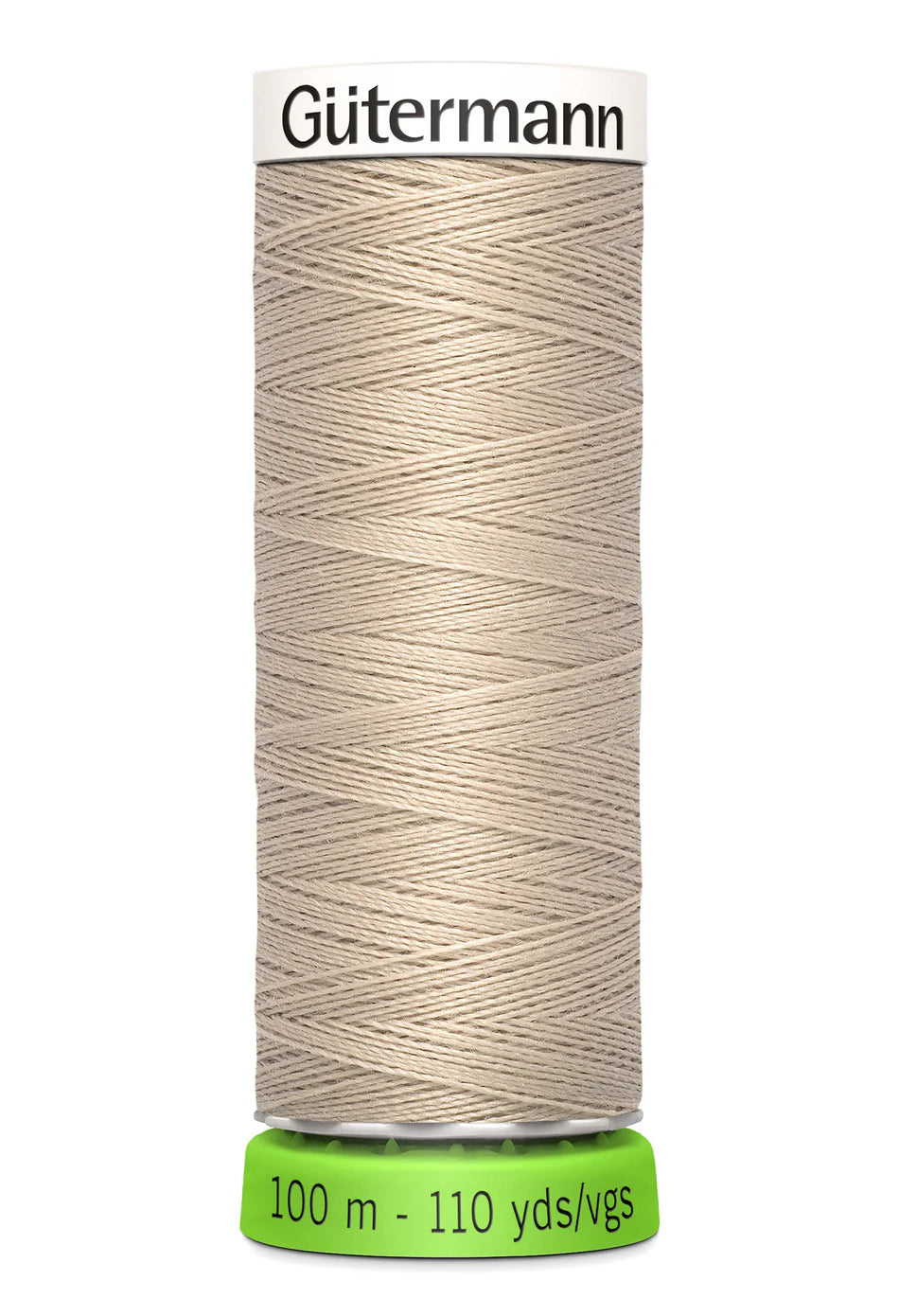 Spool of beige Gutermann thread on a white background