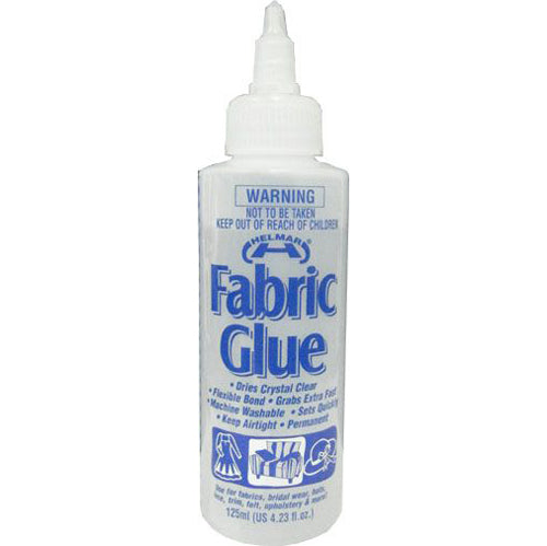 Bottle of Helmar fabric glue with label on a white background