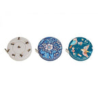 Three decorative tape measures with floral and nature-themed designs on a white background