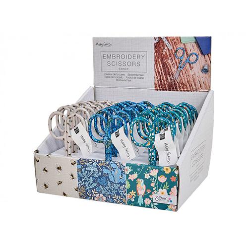 Display of embroidery scissors with floral packaging in a box