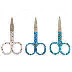 Three pairs of scissors with floral handles on a white background