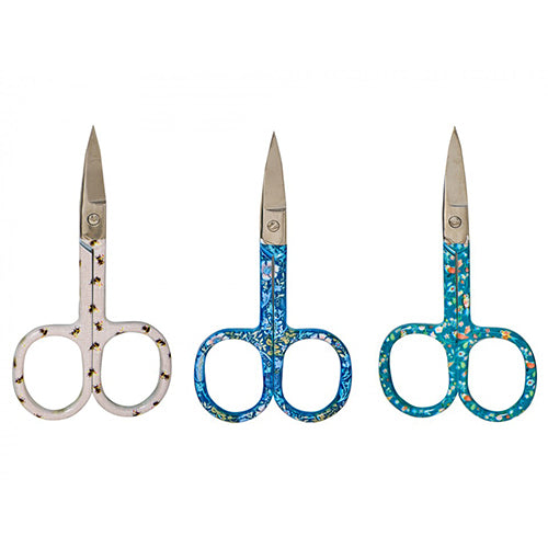 Three pairs of scissors with floral handles on a white background