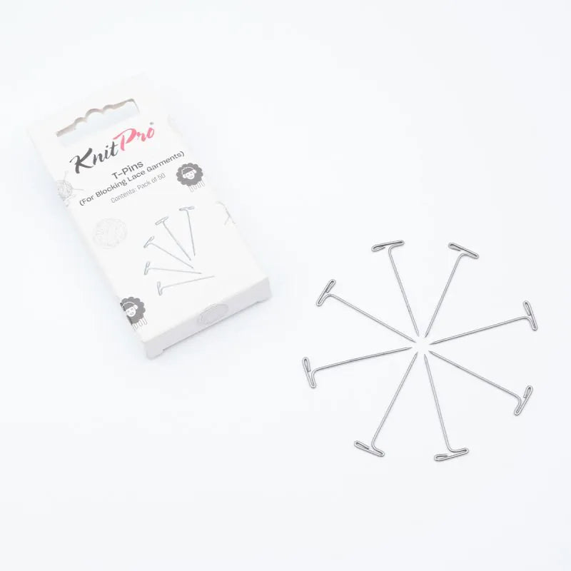 Set of metal pins with packaging labeled 'KnitPro' on a white background