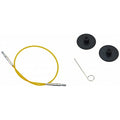 Yellow Knitting needle cable on a white background