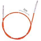 Red circular knitting needle with silver ends on a white background