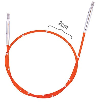 Red circular knitting needle with silver ends on a white background