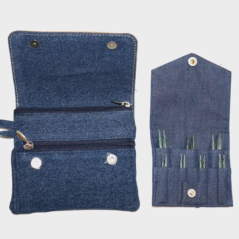 Blue denim knitting needle case with multiple compartments on a light gray background