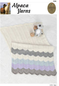 A knitted baby blanket in beige, blue, and gray stripes, accompanied by a small plush toy.