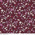 A Quilting fabric from the Liberty of London Flower Show Botanical Jewel Collection featuring a floral design with various colors including purple, red, and burgundy.