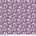 A fabric from the Liberty Fabrics Flower Show Collection featuring a purple background with a white floral Quilt Fabric.