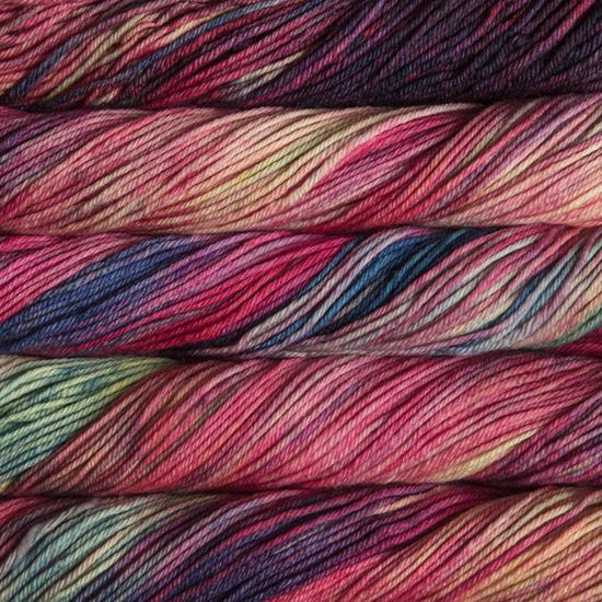 Close-up of multicolored Malabrigo Rios yarn with pink, purple, and green hues.