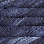 Close-up of multicolored Malabrigo Rios yarn with multi-blue to navy hues.