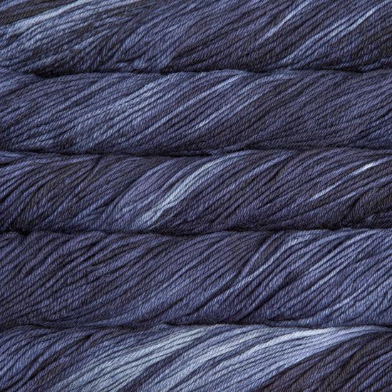 Close-up of multicolored Malabrigo Rios yarn with multi-blue to navy hues.