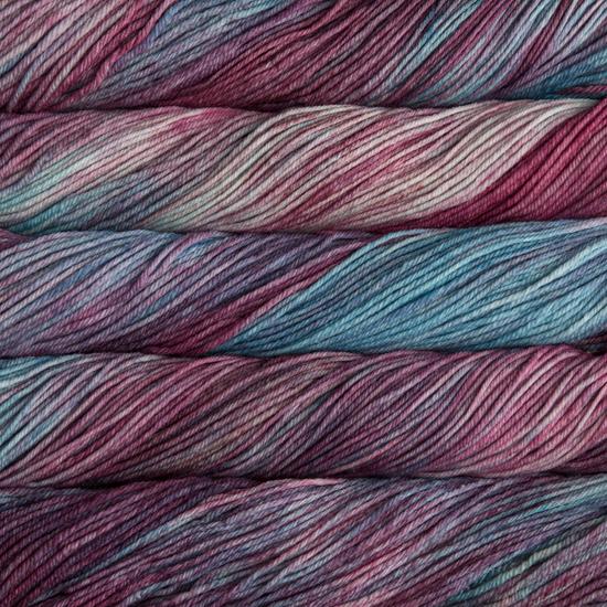 Close-up of multicolored Malabrigo Rios yarn with pink, purple and turquoise hues.