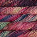 Close-up of multicolored Malabrigo Rios yarn with pink, purple, and green hues.