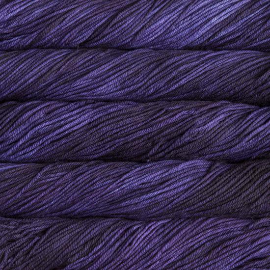 Close-up of multicolored Malabrigo Rios yarn with purple hues.