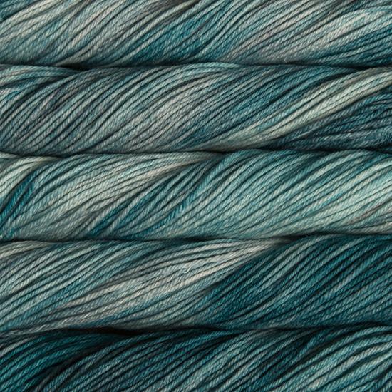 Close-up of multicolored Malabrigo Rios yarn with blue-green hues.