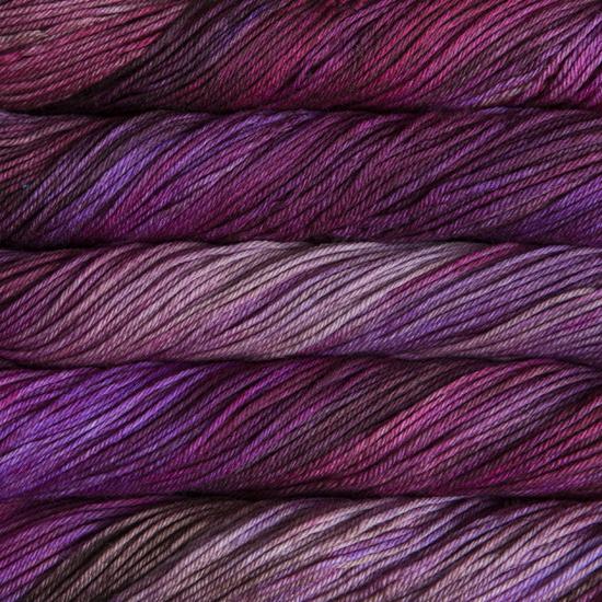 Close-up of multicolored Malabrigo Rios yarn with pink and purple hues.