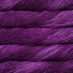 Close-up of multicolored Malabrigo Rios yarn with multi-purple hues.