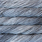 Close-up of multicolored Malabrigo Rios yarn with multi-grey hues.