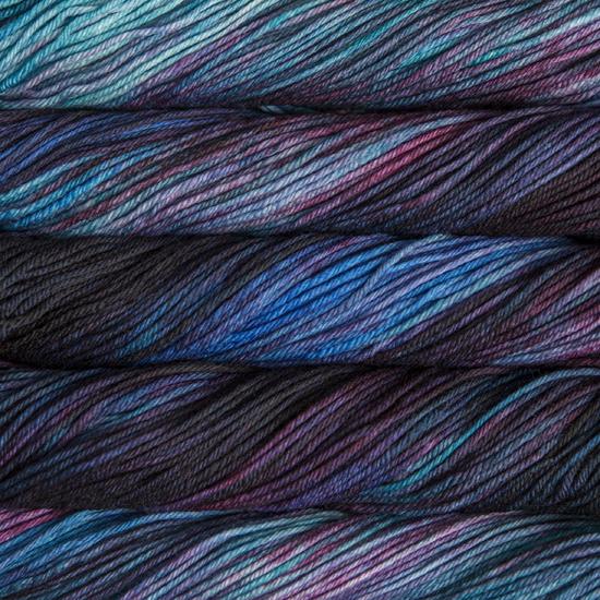 Close-up of multicolored Malabrigo Rios yarn with blue and purple hues.