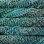 Close-up of multicolored Malabrigo Rios yarn with multi-blues & green hues.