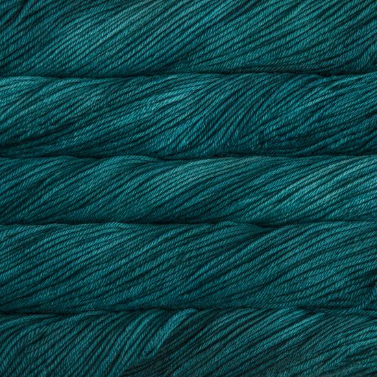 Close-up of multicolored Malabrigo Rios yarn with multi-teal hues.