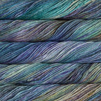 Close-up of multicolored Malabrigo Rios yarn with turquoise, blue, green & purple hues.