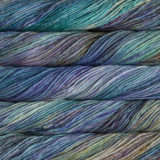 Close-up of multicolored Malabrigo Rios yarn with turquoise, blue, green & purple hues.