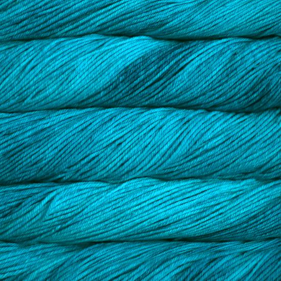 Close-up of multicolored Malabrigo Rios yarn with multi-turquoise hues.