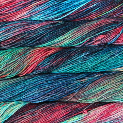 Close-up of multicolored Malabrigo Rios yarn with pink, green, and blue hues.