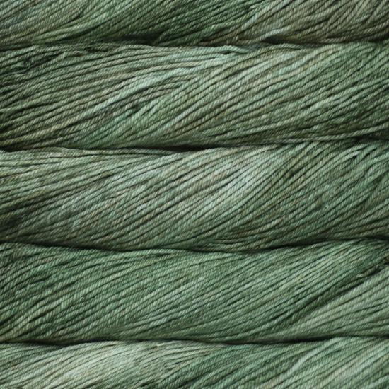 Close-up of multicolored Malabrigo Rios yarn with multi-green hues.