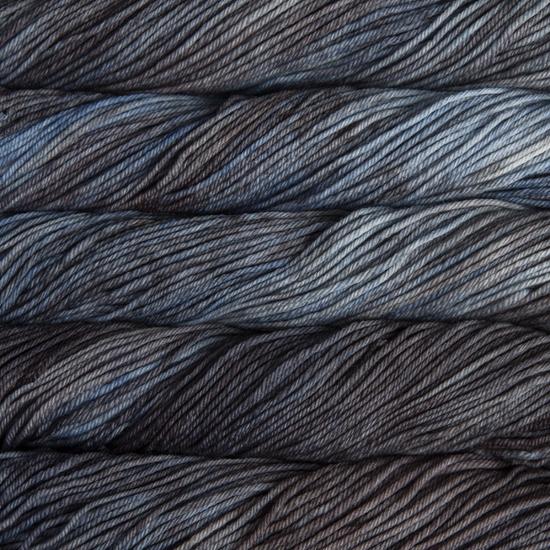Close-up of multicolored Malabrigo Rios yarn with blue and charcoal hues.  