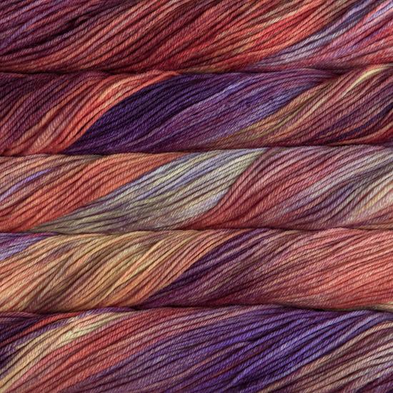 Close-up of multicolored Malabrigo Rios yarn with purple, orange and  amber hues.