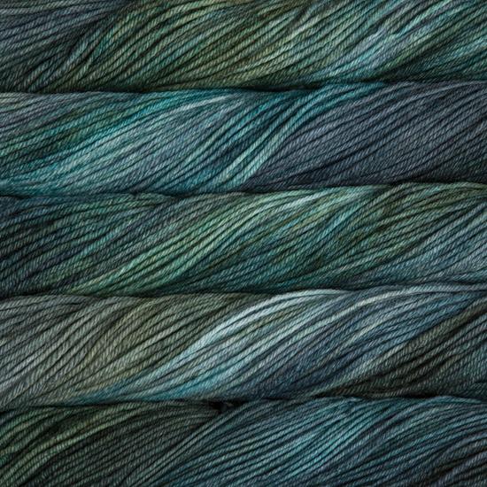 Close-up of multicolored Malabrigo Rios yarn with blue and green hues.