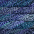 Close-up of multicolored Malabrigo Rios yarn with blue and purple hues.
