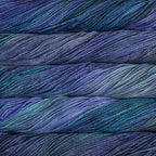 Close-up of multicolored Malabrigo Rios yarn with blue and purple hues.