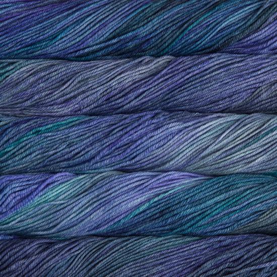 Close-up of multicolored Malabrigo Rios yarn with blue and purple hues.