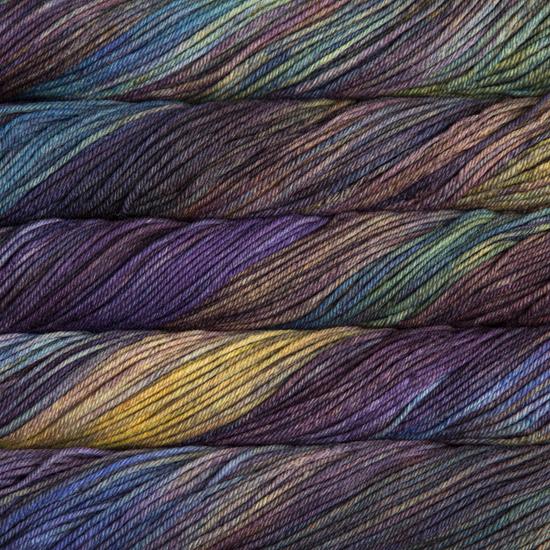 Close-up of multicolored Malabrigo Rios yarn with purple, blue & rust tones.