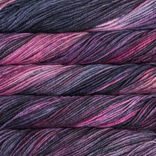 Close-up of multicolored Malabrigo Rios yarn with pink, purple and grey hues.