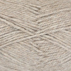 Close-up of dark beige yarn with a tweedy texture