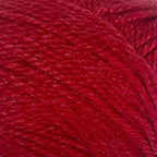 Close-up of a ball of New Zealand possum-blend red yarn
