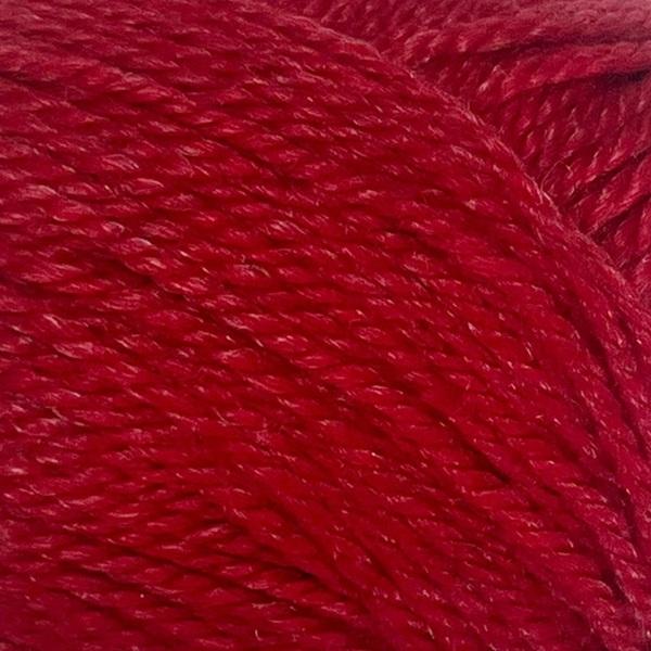 Close-up of a ball of New Zealand possum-blend red yarn