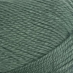 Close-up of a ball of New Zealand possum-blend green yarn