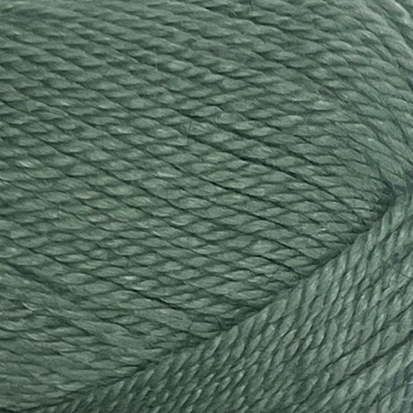 Close-up of a ball of New Zealand possum-blend green yarn